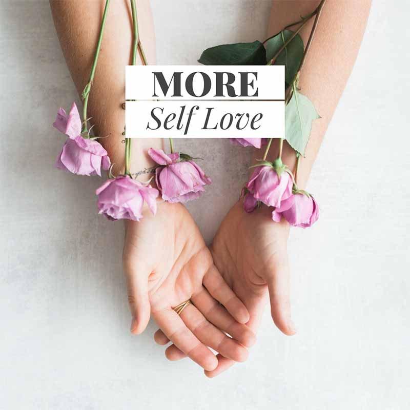 Womans hands palms facing up with lilac roses