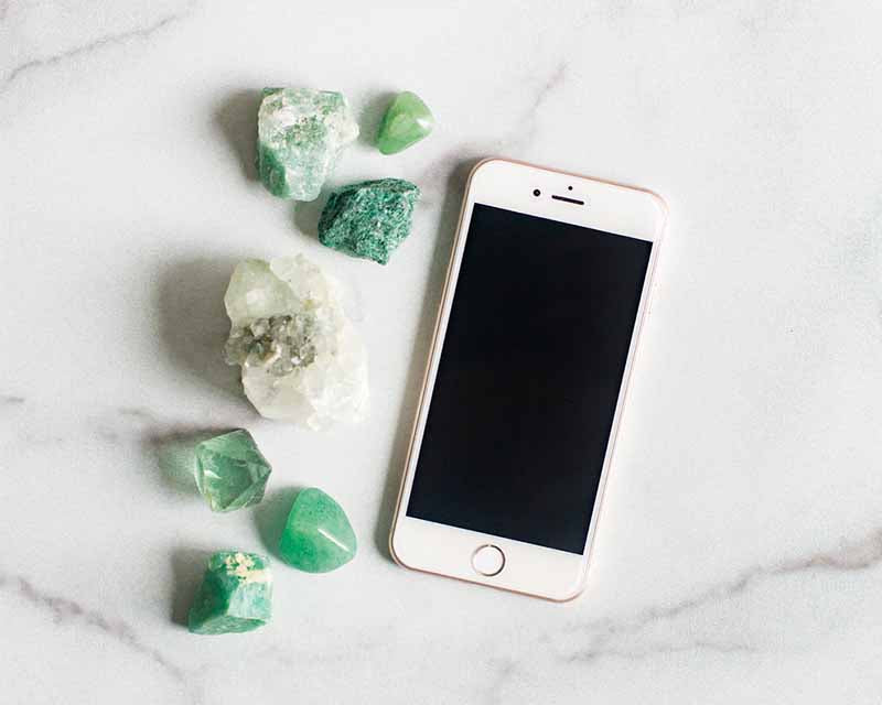Phone and green crystals